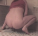A woman squats on the floor and takes a dump. Video is somewhat dark and fuzzy. Over a minute.